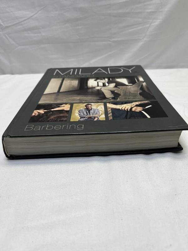 Milady Standard Barbering Hardcover Textbook, Used Good Condition gallery